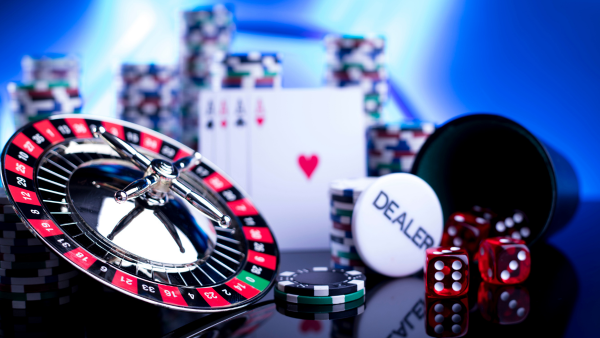 casino chips, a roulette wheel, cards, and dice