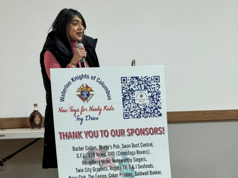 Woman behind a podium speaking